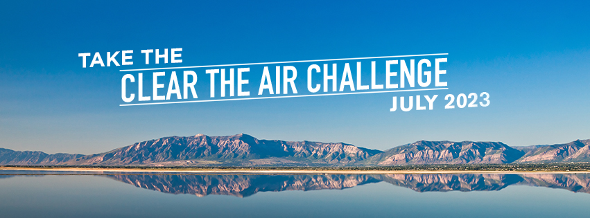 Graphic reads: Take the Clear The Air Challenge July 2023 with a graphic of a mountain range and a clear blue sky 